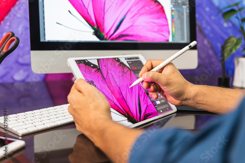 Close Up view. Man using a tablet. Man Drawing
