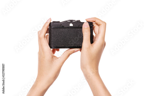 Woman hand hold a vintage camera isolated on white.