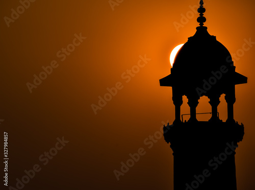 silhouette of the mosque at sunset photo