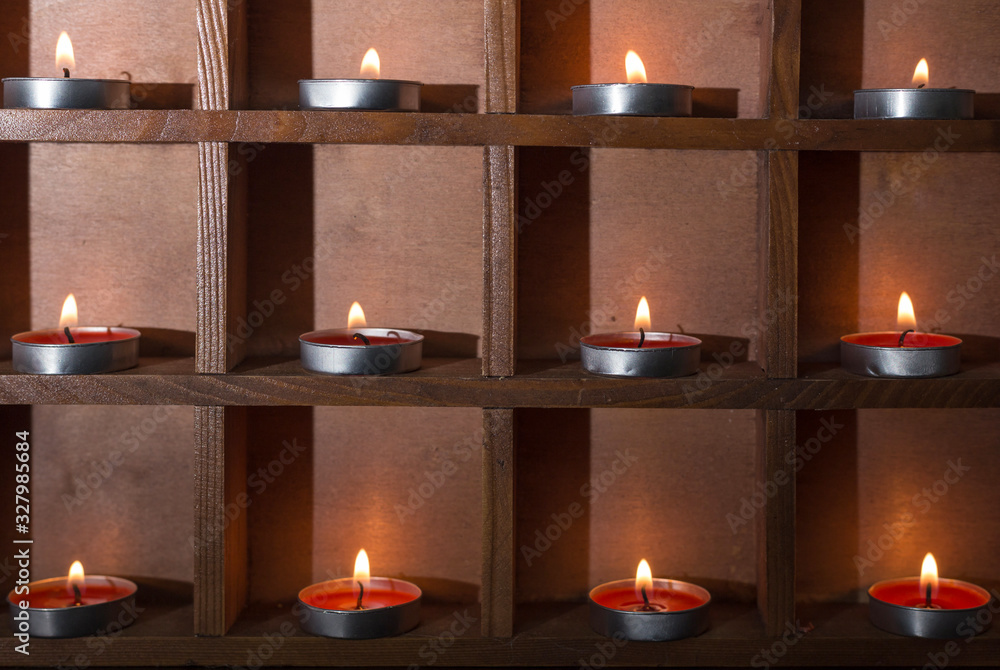 Candles burning on a black background Candles burning on a black background