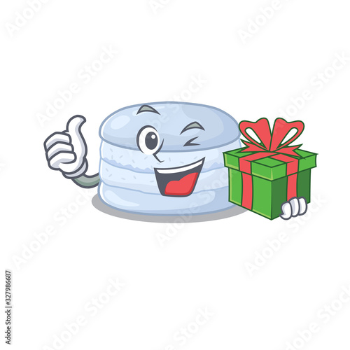 Happy blueberry macaron character having a gift box