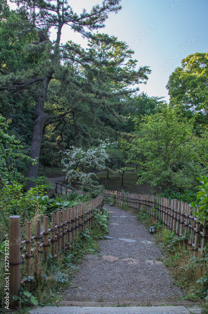 Gravel path with bamboo fences in Japanese garden (Yokohama, Kanagawa, Japan) Gravel path with bamboo fences in Japanese garden (Yokohama, Kanagawa, Japan)