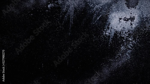 Real frost on a window. Frostwork pattern ice crystals on black background. Dark surface with abstract ice structure makes to overlay or add a frost effect.