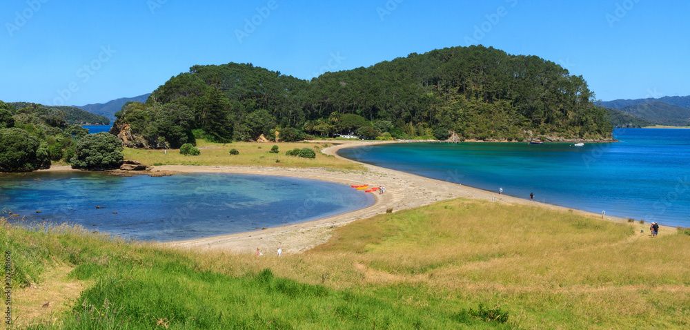 Motuarohia Island in the Bay of Islands, New Zealand. Two beautiful bays separated by a strip of sand