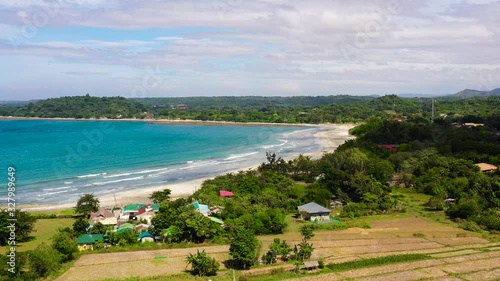 Luzon island coast, aerial view. Agricultural fields and forest on the island.
