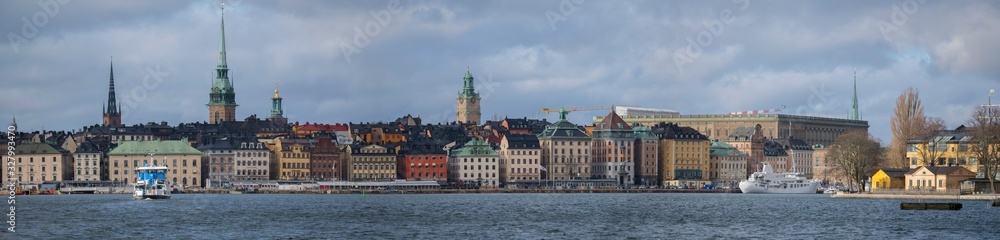 Roofs and church towers of the old town Gamla Stan in Stockholm a winter day
