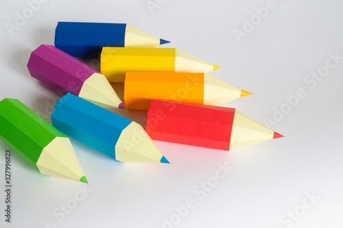 Pencil made of paper. The color of the rainbow.