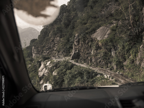 Driving through dangerous mountain roads in the Himalayas (ID: 327998471)