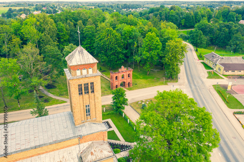 Beautiful Aerial view photo from flying drone panoramic on Akniste,  Latvia. Catholic Church In Sunny Summer Day. Architectural Heritage. (series)