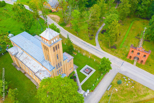 Beautiful Aerial view photo from flying drone panoramic on Akniste,  Latvia. Catholic Church In Sunny Summer Day. Architectural Heritage. (series) photo