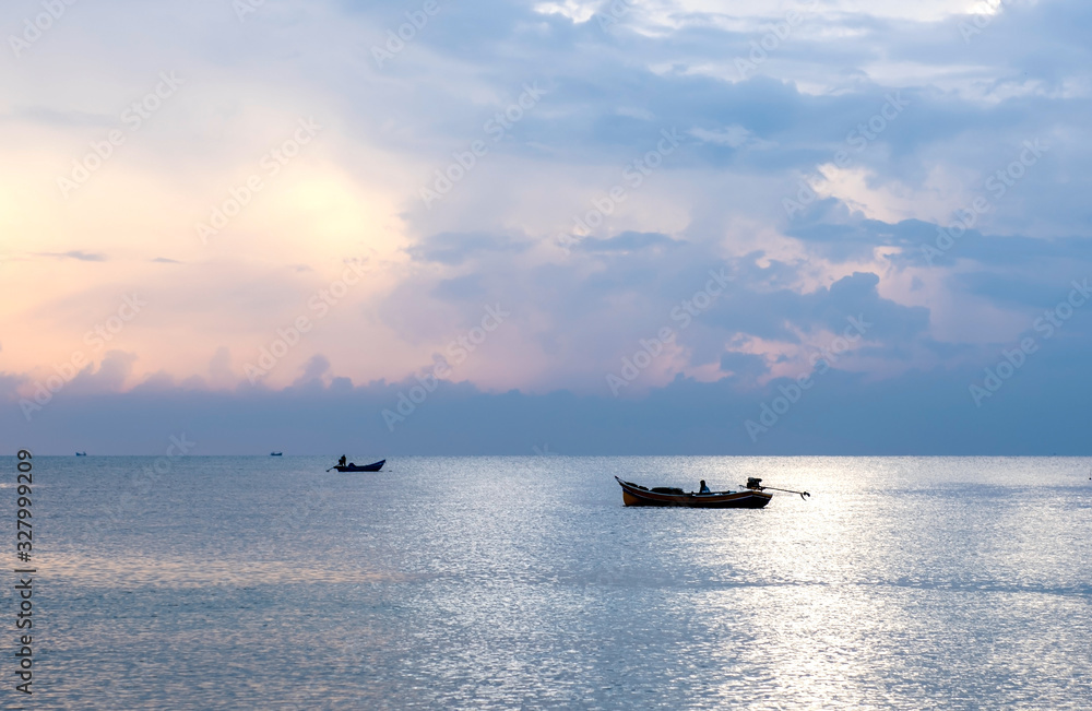 Fishing boats find local fish in the morning , strong sunlight until the image with a beautiful thailand Fishing boats find local fish in the morning , strong sunlight until the image with a beautiful thailand