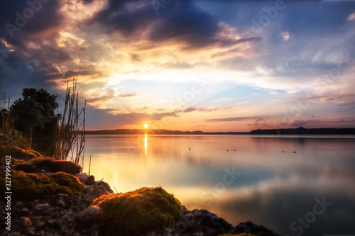 Beautiful sunset at lake Chiemsee in Bavaria or. Great reflections in the water