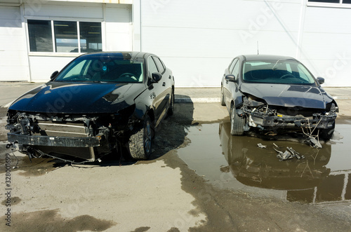 Seriously damaged vehicle near car service © Aikon