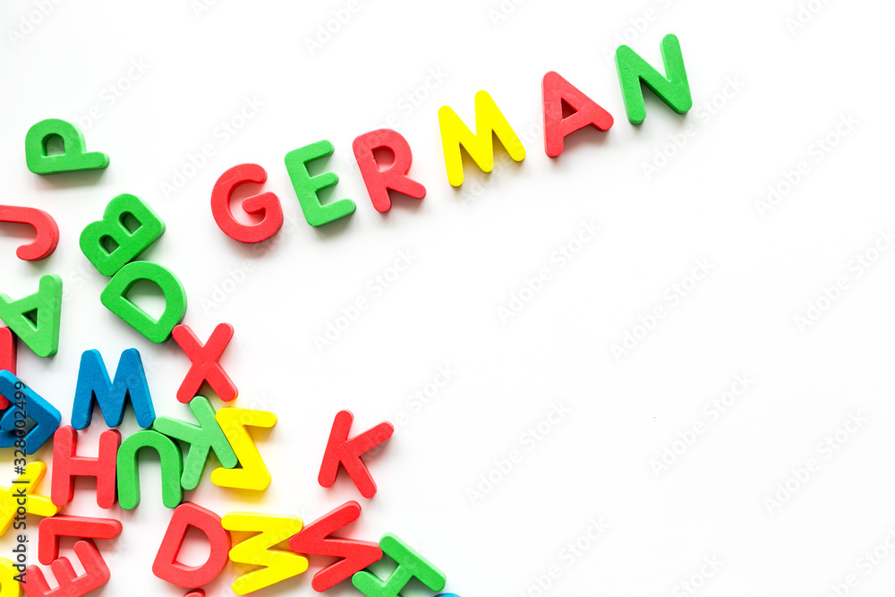 Learn German. Concept with letters on white background top-down copy space Learn German. Concept with letters on white background top-down copy space