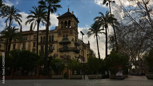 4K Timelapse of Hotel Alfonso XIII on the busy street of San Fernando in Seville City. Hotel Alfonso XIII was Designed by Architect José Espiau y Muñoz.  photo