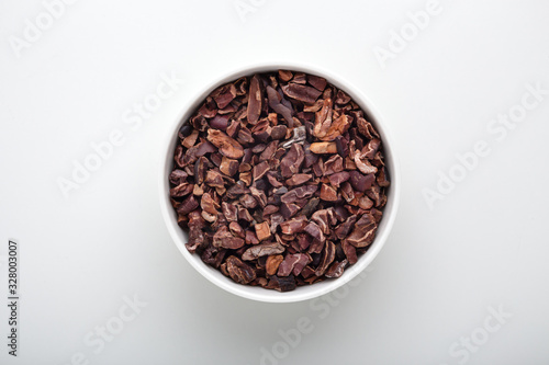 Cacao nibs in white bowl