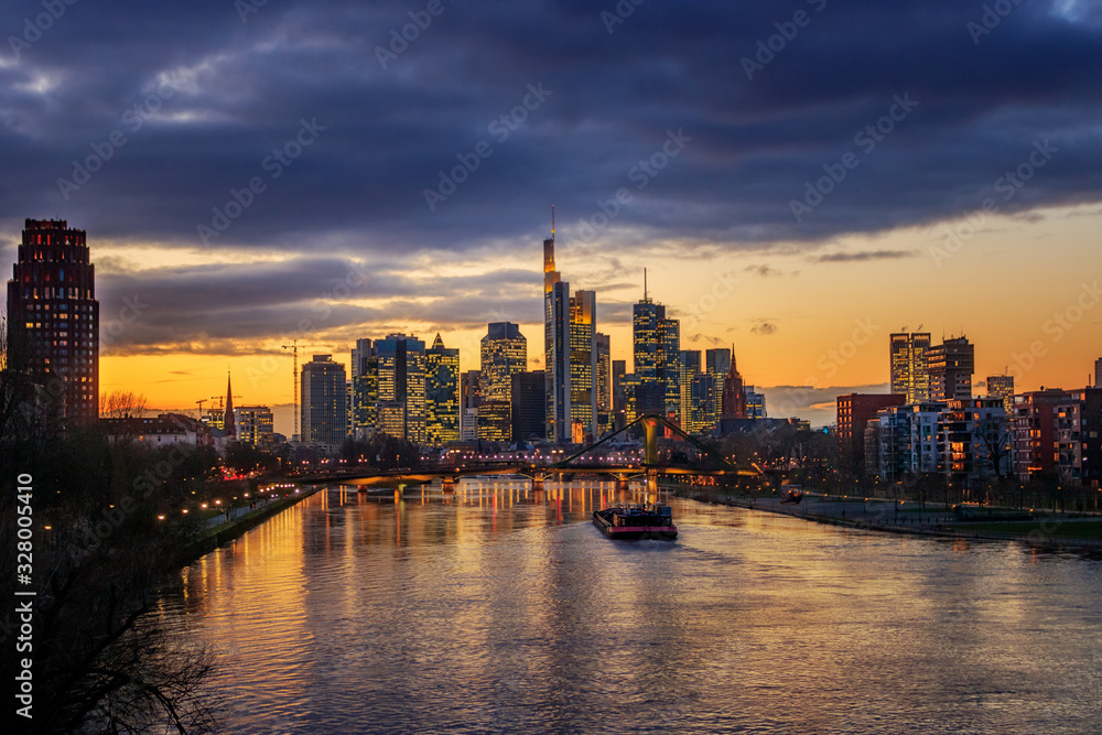 Nice night shot from Frankfurt am Main in Germany. City view in the evening with city lights and illuminated skyline on the river main
