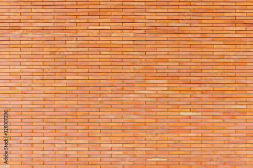 Abstract background from brown brick pattern on wall.
