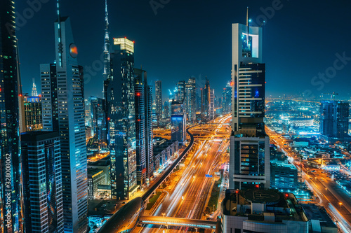 Panorama of Dubai downtown at night from above, United Arab Emirates. © DedMityay