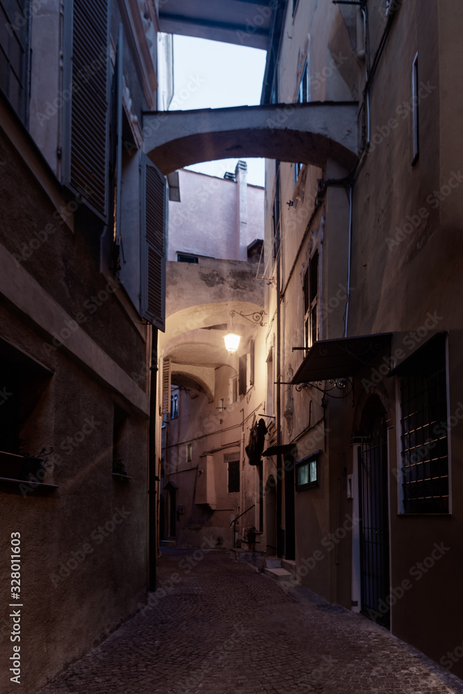 Italian narrow street by night