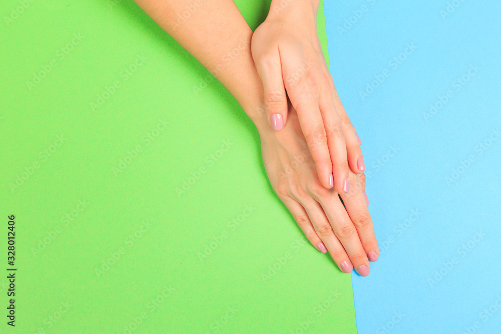 female manicure. Beautiful young woman's hands on pastel color background - Image female manicure. Beautiful young woman's hands on pastel color background - Image