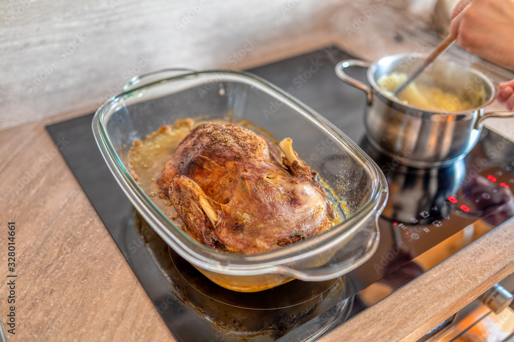 Homemade Roasting Duck in oven. Crispy whole roast duck. Homemade Roasting Duck in oven. Crispy whole roast duck.