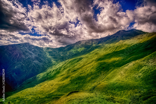 Green landscape with clouds in Georgian moontains
