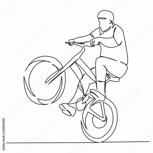 man jumping on a bicycle
