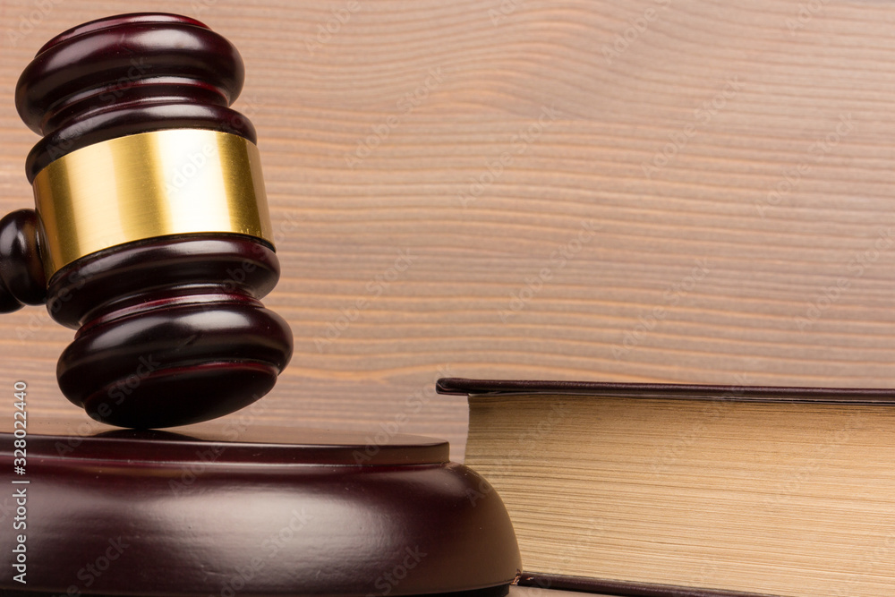 Wooden judges gavel on wooden table, close up. Space for text Wooden judges gavel on wooden table, close up. Space for text