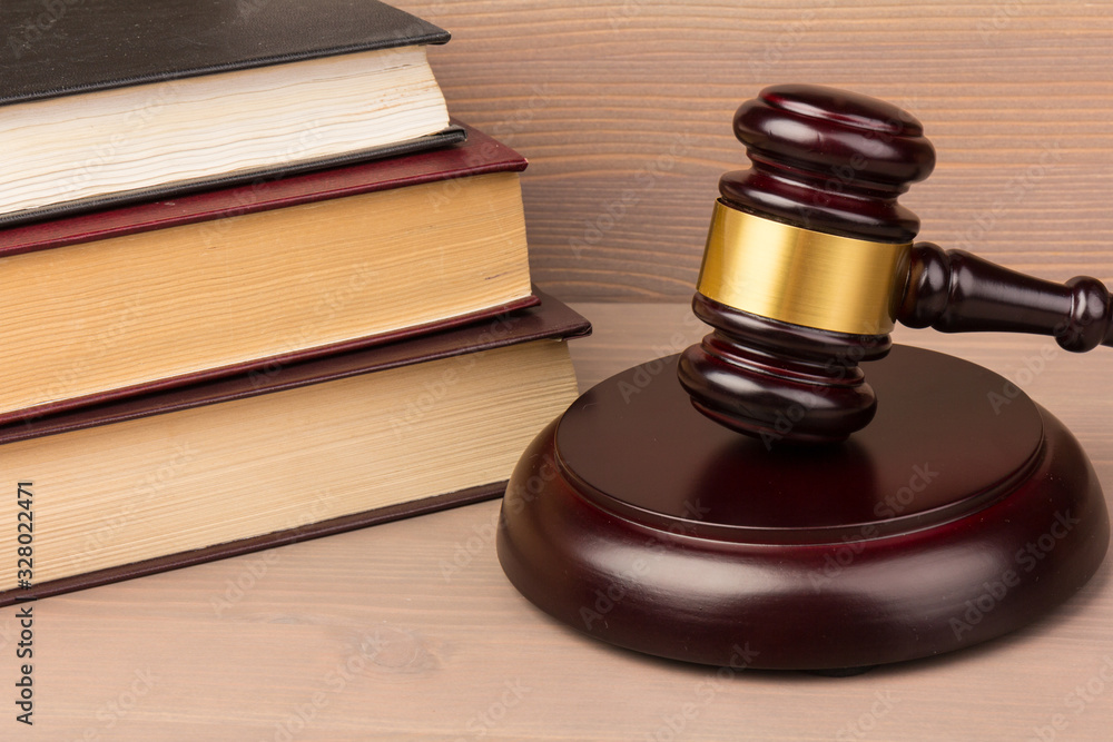 Wooden judges gavel on wooden table, close up. Space for text Wooden judges gavel on wooden table, close up. Space for text