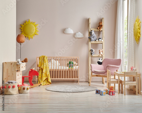 Modern baby room concept cradle bed and wooden cabinet, toys and table style. © UnitedPhotoStudio