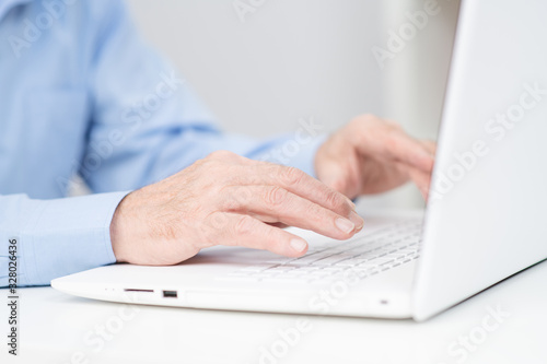 Adult businesswoman working at home using computer, studying business ideas on a pc screen on-line.