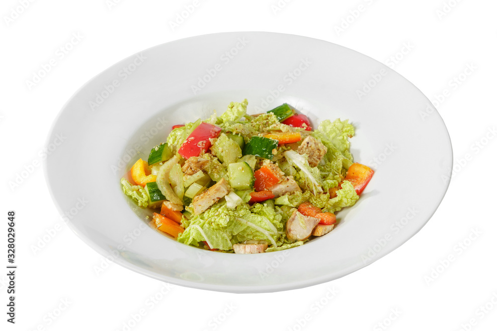 Caesar salad with pieces of chicken breast, tomato, bell pepper, cucumber, lettuce, walnuts on plate, white isolated background Side view. For the menu, restaurant, bar, cafe