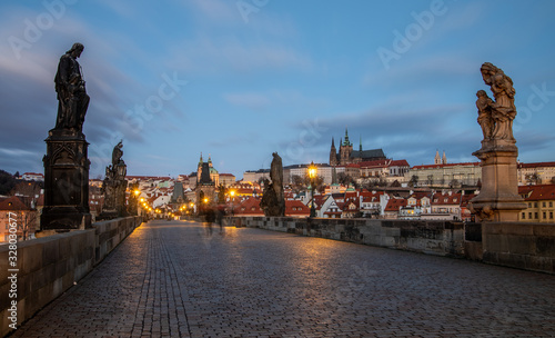 Morning at Charles Bridge - view at Hradcany Castle just before sunrise