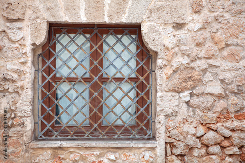 window is closed by metal bars