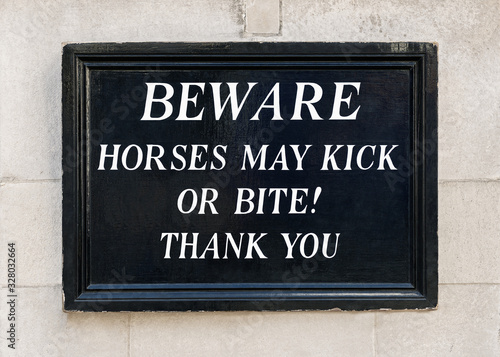 Beware horses may kick or bite sign, Horse Guards building, London, England, United Kingdom