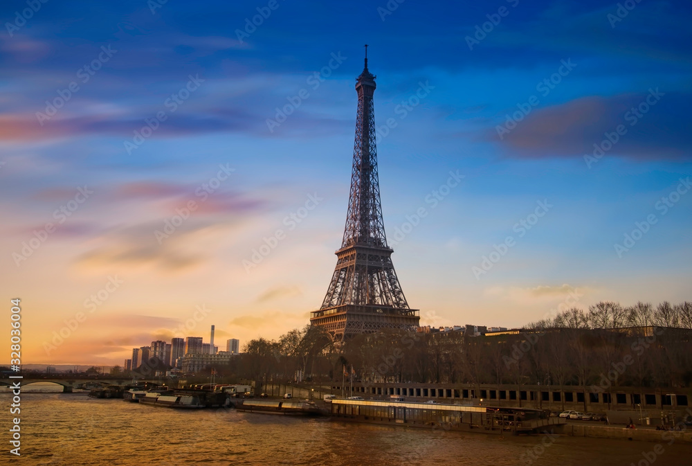 Eiffel tower and Seine river in the sunset sky scene.