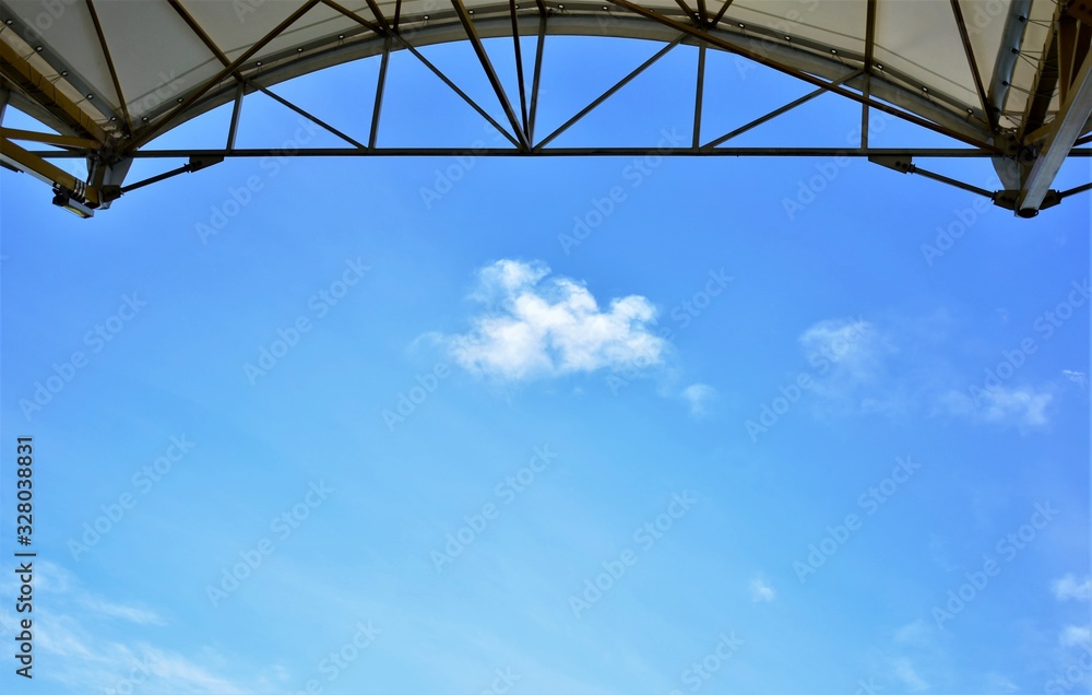 stadium canopy for spectators  cloud on blue sky background