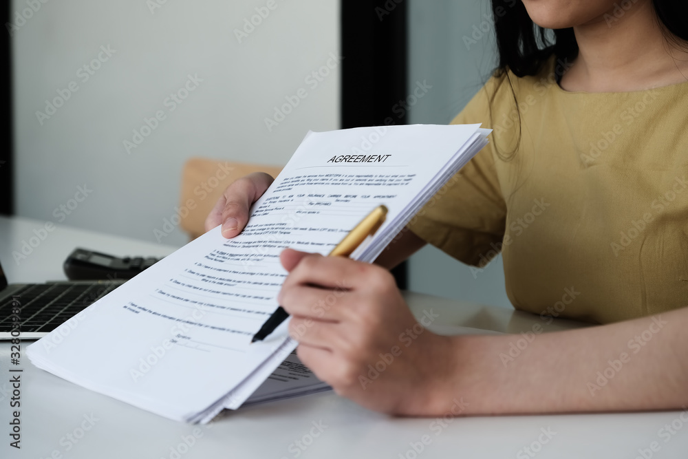 Business woman and partner sign a contract investment professional document agreement in meeting room. Business woman and partner sign a contract investment professional document agreement in meeting room.