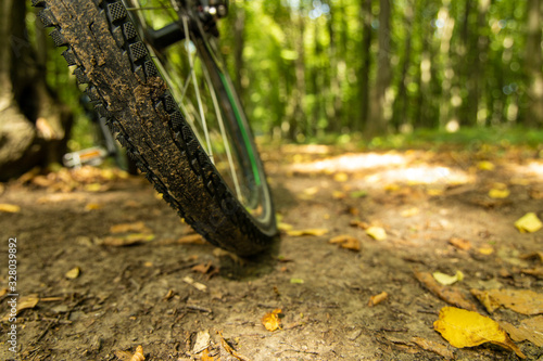 cycle tire wheel dirt ground soft focus vehicle object unfocused blurred outdoor nature background space