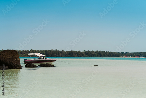 Beautiful sea landscape with tropical coast and the speed boat © ANR Production