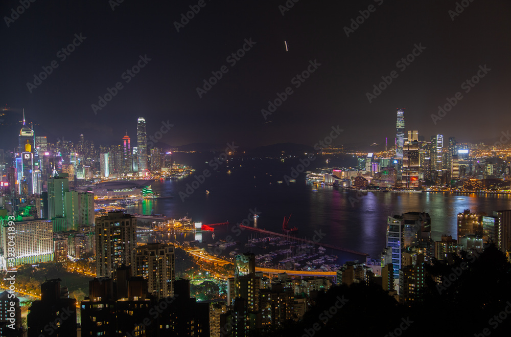 Cityscape Hong Kong city buildings surround wide harbour