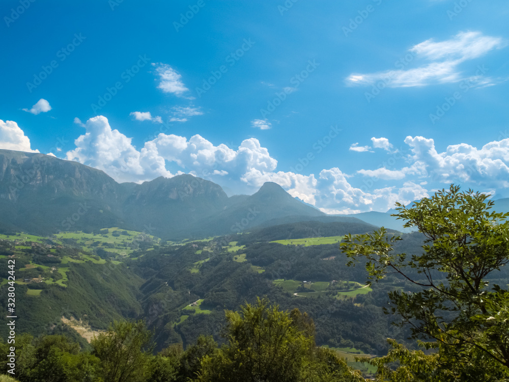 The view of the dolomite mountain is south Tirol in Italy. Sunny summer day with blue sky and clouds.