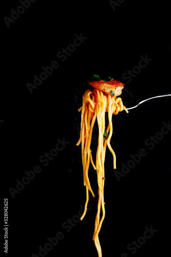  shrimp on a fork with pasta