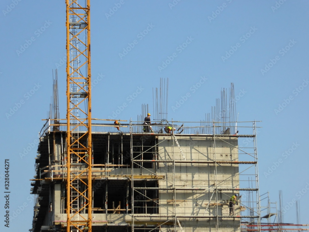 Belgrade, Serbia, 28th September 2016 - Construction building with crane and workers