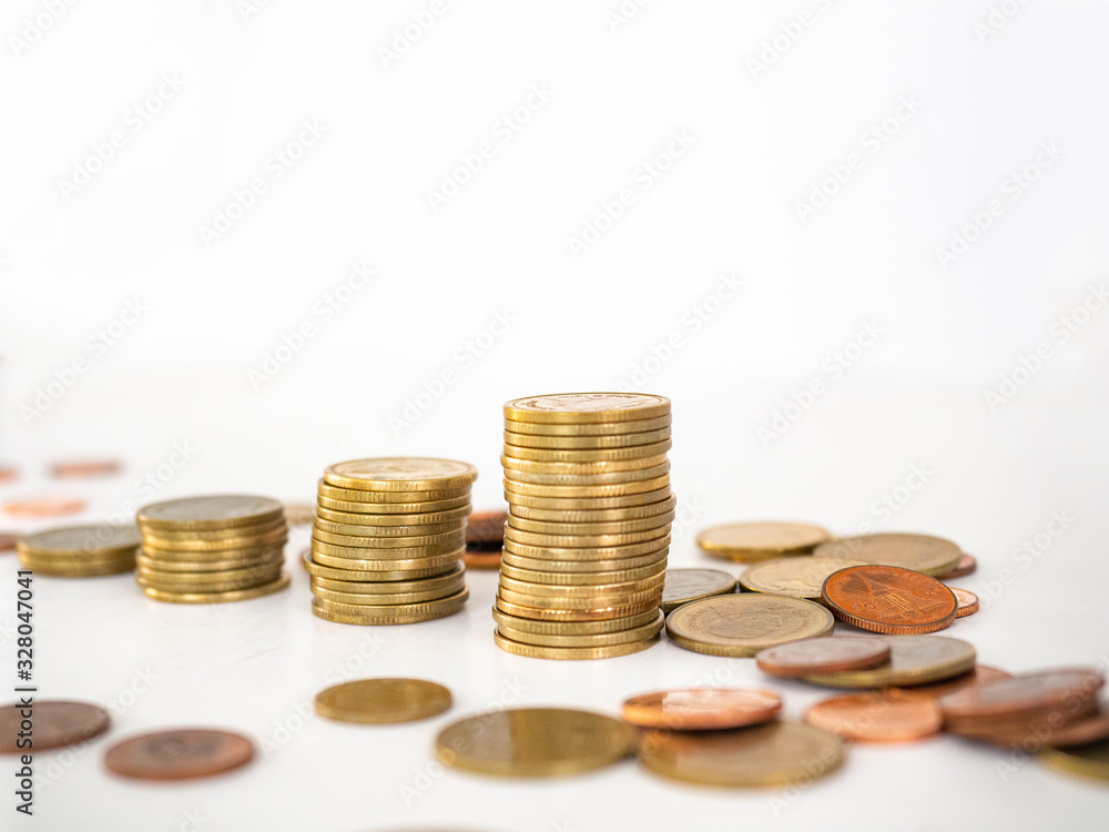 Thai Baht Coins colors Gold set in the mountains,Is the currency of Thailand.For business expenses,Coin is in a jar of money saving,White background Thai Baht Coins colors Gold set in the mountains,Is the currency of Thailand.For business expenses,Coin is in a jar of money saving,White background