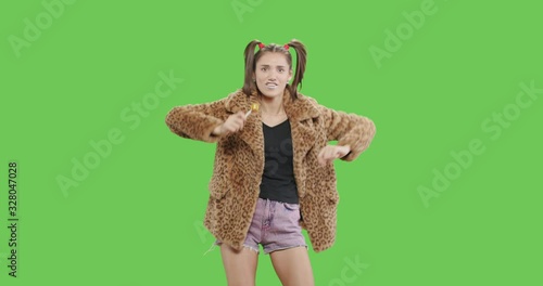 female model wearing leopard fur coat licking candy photo