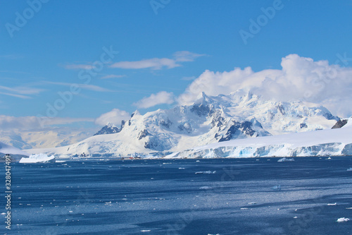 Frozen coasts, icebergs and mountains of the Antarctic Peninsula. The Chilean González Videla Antarctic Base in Paradise Bay on the Danco Coast, Antarctica