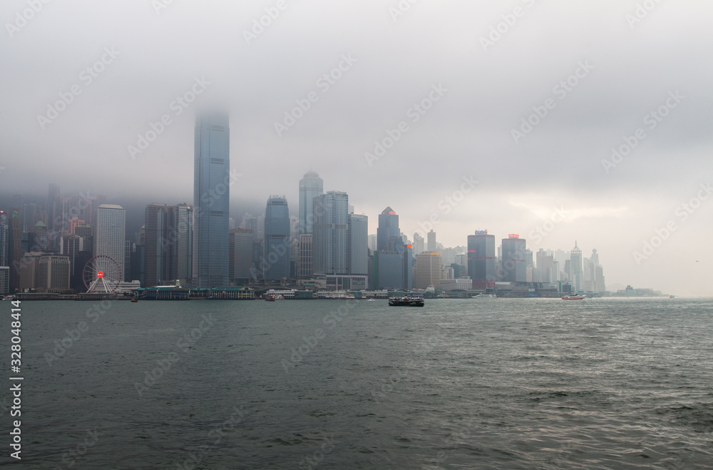 Hong Kong boats sail against Wan Chai district Hong Kong boats sail against Wan Chai district
