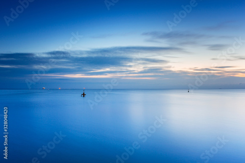 Beautiful sunrise over calm Baltic Sea in Poland